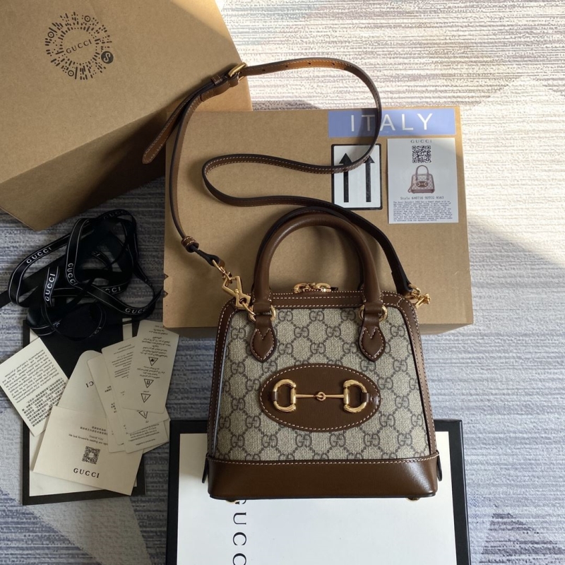 G*u*i top handle bags